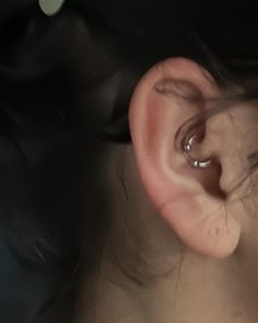 an ear is shown with the top part of it being pierced in to the side