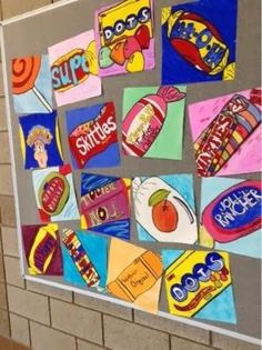 a bulletin board covered in lots of colorful pictures