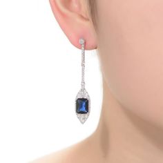 Dazzling with blue and white cubic zirconia gemstones, these sterling silver drop earrings lend an elegant touch to your wardrobe. Dazzling with blue and white cubic zirconia gemstones, these sterling silver drop earrings lend an elegant touch to your wardrobe. Length: 53 mm Backings: post Metal: sterling silver Plating: rhodium Finish: polished Packaging: boxedSTONE DETAILS Stone type: cubic zirconia Total weight: 9 5/8 ct. Shape: baguette cut, emerald cut, round Setting: bezel, prong Gemstones Blue Diamond Drop Earrings With Accents, Blue Cubic Zirconia Diamond Earrings For Formal Events, Blue Diamond Earrings With Sparkling Stones, Blue Diamond Drop Earrings For Formal Occasions, Sapphire Crystal Drop Earrings For Formal Occasions, Sapphire Dangle Crystal Earrings For Formal Occasions, Sapphire Crystal Dangle Earrings For Formal Occasions, Sapphire Crystal Dangle Earrings For Formal Events, Blue Cubic Zirconia Diamond Earrings For Wedding