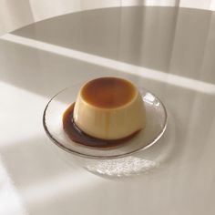 a small dessert is sitting on a glass plate