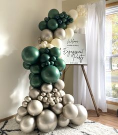 a bunch of balloons are stacked on top of each other in the shape of a pyramid