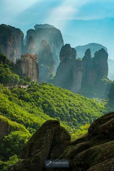 the mountains are covered in lush green vegetation