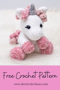 a crocheted unicorn sitting on top of a white fur covered floor with text overlay that reads free crochet pattern