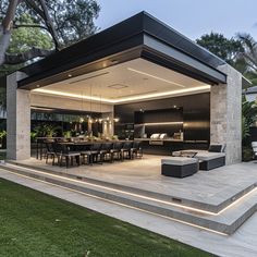 an outdoor living area with tables and chairs