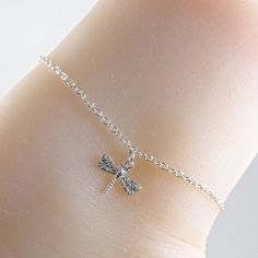 Silver dragonfly anklet made with a lovely and dainty sterling silver dragonfly charm that is suspended on a sterling silver chain with a sterling silver clasp. Choose the size anklet you need from the drop-down menu, bearing in mind that the anklet should be approximately one inch larger than the size of your ankle. The anklet will arrive in an attractive gift box. Delicate Adjustable Silver Anklets, Silver Anklet With Lobster Clasp For Gift, Dainty Adjustable Sterling Silver Anklets, Adjustable Hypoallergenic Sterling Silver Anklets, Silver Anklet, Dragonfly Charm, Silver Anklets, One Inch, Chicago Il