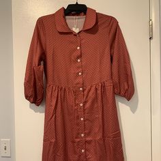 This Dress Has Never Been Worn, But Hanging In My Closet For A While. The Brand Is Petallush And Still Has The Tag. This Dress Has A Silky Texture And The Skirt Has A Liner Shown In The Photos Above. The Dress Is Labeled Small, But It Seems A Bit Large For A Small. The Bust Is About 36 Inches Around, The Waist Is About 29 Inches And Stretches To About 26 Inches. The Length From The Shoulder To The Bottom Of The Dress Is About 40 Inches. The Arm Opening Is About 19 Inches Around The Shoulder Area Silky Texture, Button Up Dress, Black Polka Dot, Polka Dot, Colorful Dresses, The Dress, Polka Dots, Button Up, Midi Dress