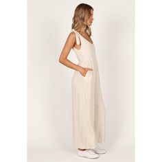 Step up your casual look this season with a linen wide leg jumpsuit. Cut in an easy-to-wear pull on design, it features tie close shoulder straps and an elasticized waist band to create the perfect fit, while functional pockets add practicality. Relaxed Spring Jumpsuits And Rompers, Beige Linen Casual Jumpsuits And Rompers, Beige Linen Summer Jumpsuits And Rompers, Casual Beige Jumpsuits And Rompers For Vacation, Casual Beige Jumpsuit For Vacation, Linen Jumpsuit For The Beach, Summer Linen Jumpsuits And Rompers In Relaxed Fit, Summer Linen Jumpsuits And Rompers With Relaxed Fit, Casual Cotton Jumpsuits And Rompers With Tie Straps