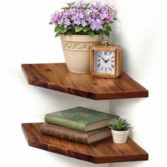 two wooden shelves with flowers and books on them