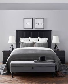 a bedroom with a bed, nightstands and two lamps on either side of the bed