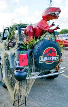 a truck decorated with fake animals and plants