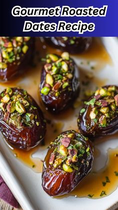 baked dates with pistachio sauce and nuts in them on a white platter