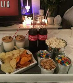 an assortment of snacks and drinks on a tray