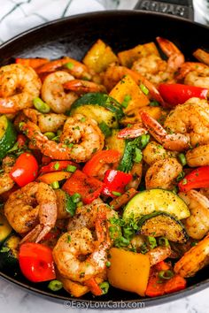 shrimp and vegetable stir fry in a skillet