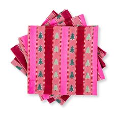 four pink napkins with trees on them