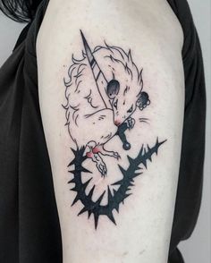 a woman with a tattoo on her arm has a black and white image of a demon