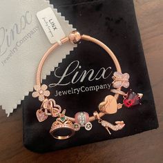 Linx Snake Chain Style Charm Bracelet In 18k Rose Gold Over 925 Sterling Silver, With A Ball Clasp. The Bracelet Is 3mm In Width And Available In Multiple Lengths. This Bracelet Comes With 9 Linx Charms In Sterling Silver And 18k Rose Gold Over 925 Sterling Silver Charms. Additional Charms Can Be Added Also And Bracelet Is Compatible With Most Brands Of Other Standard Size Charms As Well. All Items Are New And Come In A Luxury Velvet Jewelry Pouch. *Bracelet And Charms Are Superior Quality. Luxury Charm Bracelet - Perfect Gift, Luxury Charm Bracelet As Gift, Luxury Charm Bracelet For Gift, Rose Gold Sterling Silver Charm Bracelet For Anniversary, Elegant Charm Bracelet For Birthday Gift, Rose Gold Bracelet Jewelry Gift For Her, Elegant Rose Gold Charm Bracelet For Gifts, Anniversary Rose Gold Sterling Silver Charm Bracelet, Fine Jewelry Charm Bracelet As Gift