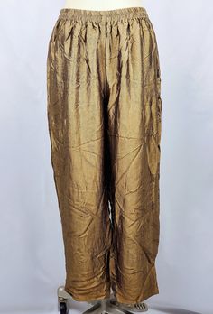 - Size: 20 Women's Petite - Condition: Vintage item in good, used condition. Overall, these pants looks well preserved and cared for. Sold AS IS. **See pictures** - Production Era: 1990s/1980s Terms of Sale Our unique finds may exhibit signs of wear indicative of their prior use and age, which we believe only adds to their vintage charm. Because these items have likely been loved by a few other hands before reaching ours, we cannot guarantee the specific storage conditions they've encountered ov Silk Straight Pants For Festive Occasions, Festive Wide Leg Silk Pants, Festive Wide Leg Silk Bottoms, Gold Silk Bottoms For Party, Party Silk Bottoms With Elastic Waistband, Silk Party Bottoms With Elastic Waistband, Traditional Silk Straight Pants, Fitted Gold Pants For Festive Season, Traditional Gold Pants For Festive Occasion