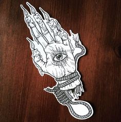 a sticker with an image of a hand that has been drawn in white ink