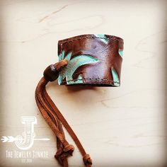 Show off your boho chic style with this women's leather cuff bracelet! This piece of genuine leather cuff jewelry features a leather strip accenting the center. This women’s cuff bracelet is handcrafted with genuine leather and hide, adding a Southern touch to your boho chic style. Wear this wide leather cuff bracelet alone or add Navajo turquoise bracelets, amazonite bracelets, and more from our bracelet bar to create your own look. Adjusts with leather ties and a wood bead that can be moved to Leather Wrist Cuff, Bracelet Bar, Turquoise Bracelets, Boho Cuff Bracelet, Boho Cuff, Leather Bracelets Women, Womens Cuff Bracelets, Leather Cuff Bracelet, Boho Style Jewelry