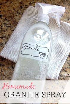 a bottle of homemade granite spray sitting on top of a counter next to a towel