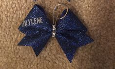 A personal favorite from my Etsy shop https://www.etsy.com/listing/456532368/cheer-bow-keychain-with-name Customizable Blue Keychains For Personal Use, Customizable Blue Keychains, Cheer Bow Keychain, Keychain With Name, Bow Keychain, Cheer Bow, Cheer Bows, Keychains, Etsy Shop