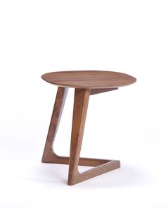 a small wooden table sitting on top of a white floor