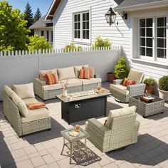 an outdoor patio with wicker furniture and potted plants