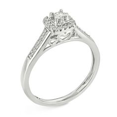 An amazing look of love, this glamorous diamond promise ring is as sweet as can be. Crafted in sterling silver, this pretty style features a 1/20 ct. princess-cut diamond - artfully set to enhance size and sparkle - wrapped in frame of glimmering petite round diamonds. The shank glistens with petite diamonds. Captivating with 1/6 ct. t.w. of diamonds and a bright polished shine, this choice is a marvelous reflection of your romance. Custom-made to fit her ring size. Sterling silver rings cannot be resized after purchase. Promise Ring With Princess Cut And Diamond Accents, Princess Cut Diamond Accents Promise Ring, Asscher Cut Diamond Promise Ring With Accents, Asscher Cut Diamond Ring With Diamond Accents, Promise Ring: Princess Cut Diamond Ring With Accents, Princess Cut Diamond Ring With Accents For Promise, White Gold Princess Cut Promise Ring, Princess Cut Diamond Ring With Halo Setting For Promise, Look Of Love