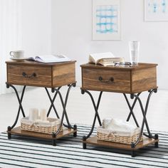 two wooden tables with metal legs and baskets on them, one has a cup in the middle