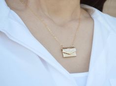 This beautiful and personalized locket necklace would be a perfect Valentine's gift for any loved one! The gold plated letter locket charm measures approximately 21x16mm (including jump ring) and is hung on a 16", 18" or 20" gold plated or 14k gold filled chain. The locket opens and you can add a tiny photo or sweet note inside. The chains are dainty and very pretty - the perfect delicate necklace for everyday wear. This sentimental gift is sure to be the recipient's favorite piece of jewelry!It Envelope Shaped Necklace For Mother's Day Gift, Gold Personalized Envelope-shaped Necklace, Jewelry Accessories Necklaces, September Birthstone Necklace, Necklace For Everyday, March Birthstone Necklace, Mama Necklace, Accessories Necklaces, Gift Envelope