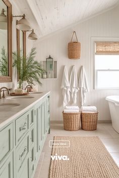 a bathroom with two towels hanging on the wall next to a bathtub and sink