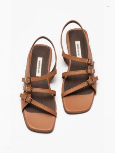 Editor's NotesSEONG YUN JOO presents feminine daily footwear that adds a sophisticated accent to your look. - Square open toes- Belted straps on the upper- Supportive ankle strap- Silver-tone hardware- Feminine and casual mood Measurements (in.)- Size: KR 220MM (US 5) ~ KR 265MM (US 9.5)- Heel: 0.55 in.*Fit true to size Composition & Care- Material: Cow Leather- Natural leather may have fine scratches and wrinkles- Bright leather can get stained by denim or dark outfits- Evening Open Toe Slingback Sandals With Tang Buckle, Modern Open Toe Heels With Tang Buckle, Dark Outfits, Natural Leather, Cow Leather, Open Toe, Ankle Strap, Silver Tone, Sandals