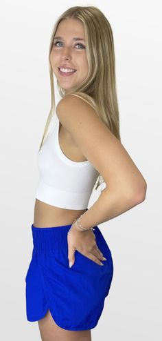 Fit and comfort for your active days. These shorts are lightweight and on trend for a perfect casual outfit. The matching jacket completes the outfit and has you prepared for those active events. Color- Blue 100% Polyester Seamless Short Tops For Spring, Casual High Stretch Shorts For Loungewear, Sporty Short Tops For Spring, Casual White Bottoms With Seamless Construction, Casual Seamless Short-length Top, Casual Seamless Shorts For Spring, High Stretch Casual Seamless Shorts, Spring Gym Cropped Tops, Casual High Stretch Seamless Shorts