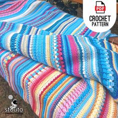 a crochet blanket is laying on the ground next to a wooden bench with text overlay that says free crochet pattern