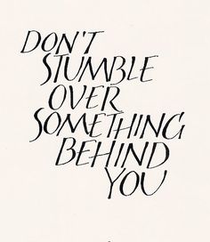 the words don't summble over something behind you are written in black ink