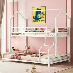 a white bunk bed sitting in a bedroom next to a pink wall with a painting on it