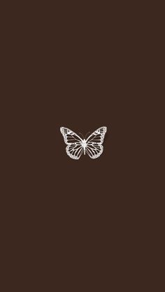 a white butterfly on a brown background