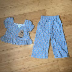 Nwt Girls Size 2t Blue Print Outfit - Ruffle Top & Pants Playful Cotton Bottoms In Matching Set, Cute Blue Cotton Pants, Cotton Bottoms With Ruffles For Playtime, Casual Ruffled Bottoms For Playtime, Casual Playwear Sets With Ruffles, Cute Cotton Pants For Playwear, Cute Spring Sets With Elastic Waistband, Casual Ruffle Bottoms For Playwear, Casual Ruffled Bottoms For Playwear