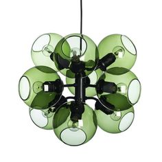 a green chandelier hanging from a ceiling fixture with eight lights in the center