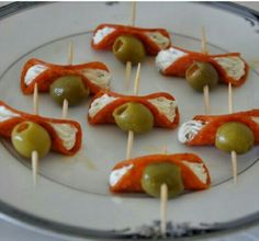 small appetizers with olives and cheese on toothpicks