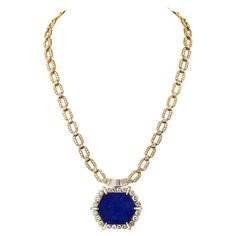 Introducing the 18K Yellow Gold 1970's Diamond Lapis Chain Necklace, an exquisite piece that captures the opulence and distinctive style of the era. Crafted circa 1970, this necklace is a stunning blend of luxurious materials and meticulous craftsmanship. The chain, measuring 22 inches, is adorned with an impressive 30.00 carats of round-cut diamonds, set into the links to create a continuous sparkle that catches the eye from every angle. Each diamond is carefully chosen for its brilliance and clarity, enhancing the necklace's overall allure. The centerpiece of this remarkable necklace is a vibrant lapis pendant, measuring 1.5 inches. The deep blue hue of the lapis lazuli is beautifully complemented by a halo of sparkling diamonds, adding a touch of sophistication and elegance to the piece Lapis Pendant, Gold Link Chain, Diamond Chain, Yellow Gold Chain, Elegant Necklaces, Fine Jewelry Collection, Gold Chain Necklace, Chain Link Necklace, Link Necklace