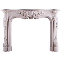 an ornate white fireplace mantel with carvings