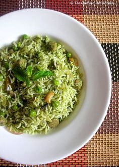 a white plate topped with rice and vegetables