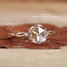 the parts of a diamond ring on top of a wooden surface with text describing it