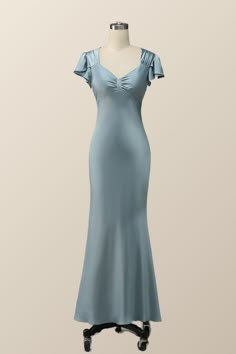 The gorgeous blue mermaid long bridesmaid dress features flare sleeves, a bow front, and a side zip-up back. Elegant Blue Bridesmaid Dress With Ruched Bodice, Elegant Mermaid Dress With Ruched Bodice, Wedding Evening Dress With Ruched Bodice And Mermaid Hem, Bridesmaid Mermaid Dress With Sweep Train, Elegant Wedding Mermaid Dress With Ruched Bodice, Elegant Ruched Mermaid Dress With Mermaid Hem, Elegant Light Blue Gown With Ruffles, Elegant Fitted Light Blue Bridesmaid Dress, Mermaid Bridesmaid Dress With Sweep Train