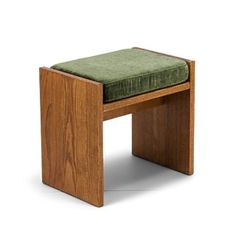 a wooden bench with a green cushion on it