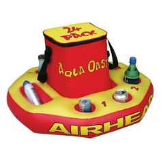 an inflatable life raft with various items on the front and side, sitting upright