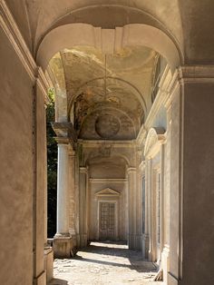 an old building with columns and arches