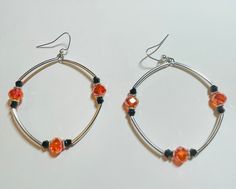 Orange and black glass beaded silver hoop earrings with stainless ear wires Adjustable Hoop Earrings With Black Beads, Adjustable Black Beaded Hoop Earrings, Silver Small Hoop Beaded Earrings With Ear Wire, Gift Black Beaded Dangle Hoop Earrings, Adjustable Hoop Earrings With Black Beads As A Gift, Gift Dangle Hoop Earrings With Black Beads, Adjustable Black Beaded Hoop Earrings As Gift, Redondo Beach, Jewelry Earrings Hoops