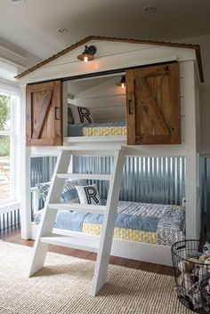 a white bunk bed with wooden shutters and ladder